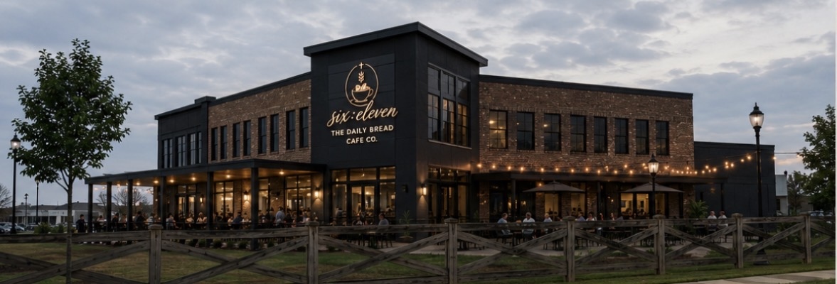 six:eleven — The Daily Bread Cafe Co. two-story exterior at dusk